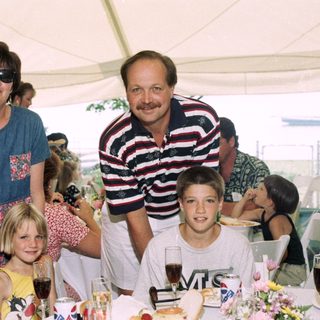 Family gathering at an outdoor event.
