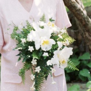 Wedding ceremony with bride, groom, officiant, and witnesses.