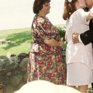 Wedding ceremony with couple sharing kiss.