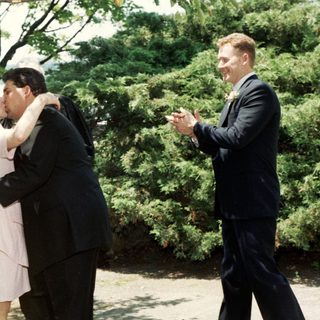 Wedding ceremony with couple sharing kiss.