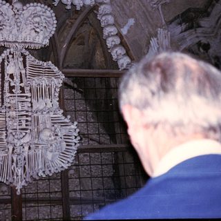 Bone-made coat of arms and cross.