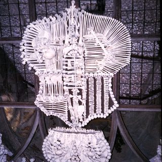 Memento mori: skeletal crown and royal crest.