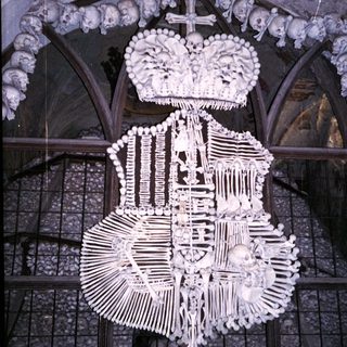 Memento mori chapel with bone chandelier and skulls.