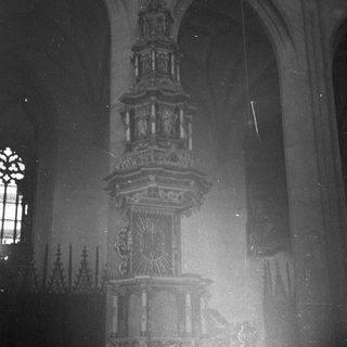 Ornate Gothic-style church pulpit with intricate carvings.