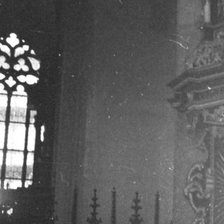 Ornate Gothic-style church pulpit with intricate carvings.