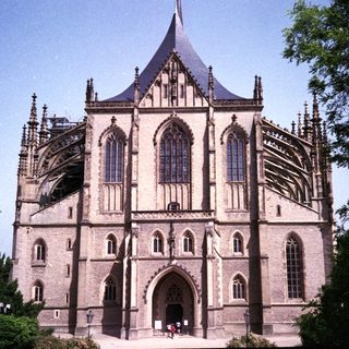 Gothic cathedral with tall spire and intricate stonework.