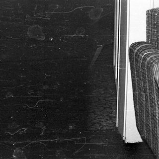 Black marble surface with faint carved designs.