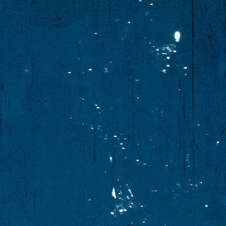 Star field with scattered celestial objects.