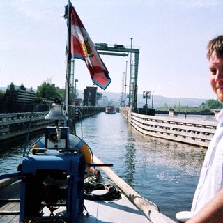 Man in naval uniform at a canal lock.