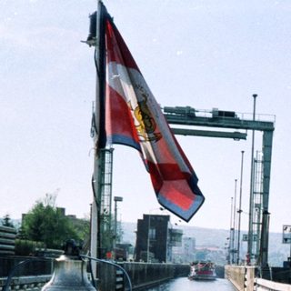 Man in naval uniform at a canal lock.