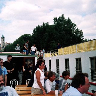 People socializing on a rooftop terrace.