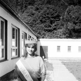 Homecoming queen in 1970s-style sash and crown.
