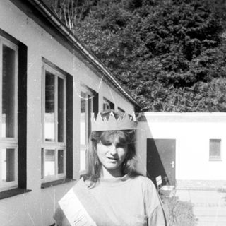 Homecoming queen in 1970s-style sash and crown.