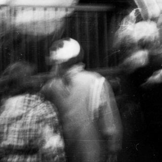 Blurred indoor scene of people in motion.