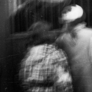 Blurred indoor scene of people in motion.