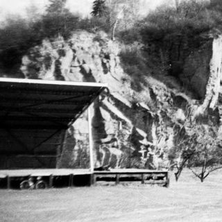 Ruins of castle atop rocky hill.
