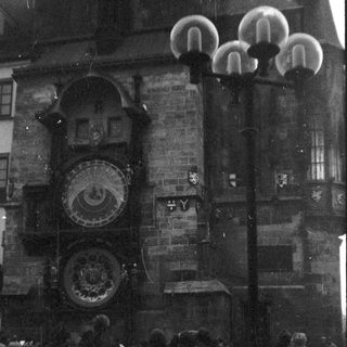 Historic astronomical clock on medieval building.