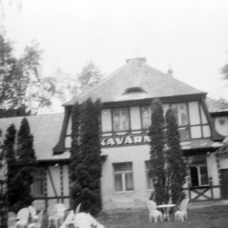 Vintage black-and-white photo of Kavarna building.