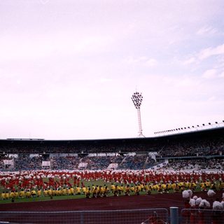 Ceremonial display at large stadium opening.