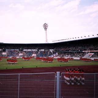 Ceremonial parade at large stadium.