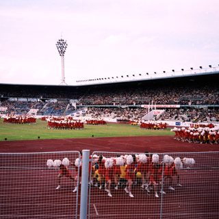 Pre-match warm-up drill at a large stadium.