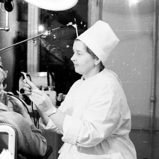 Medical procedure with patient undergoing treatment.