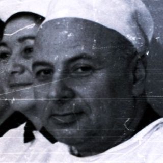 Nurses and doctor in 1950s-60s medical facility uniforms.