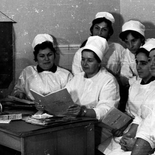 Nursing students studying in a classroom setting.