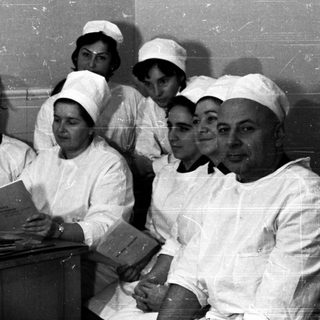 Nursing students studying in a classroom setting.