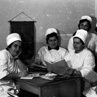 Nursing students studying in a classroom setting.