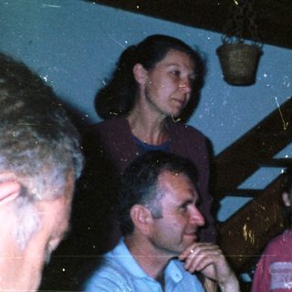 Group of people indoors, possibly at a gathering.
