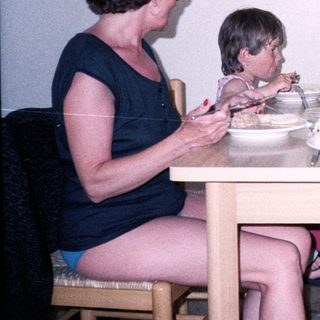 Family enjoying meal together indoors.