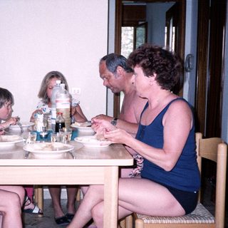 Family enjoying meal together indoors.