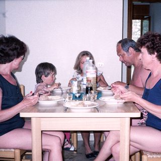 Family enjoying meal together indoors.