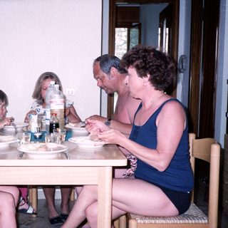 Family enjoying meal together indoors.