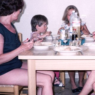 Family enjoying meal together indoors.