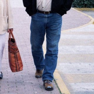 Family walking near coach with "Resident NV" label.