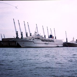 Large ocean liners docked at port.