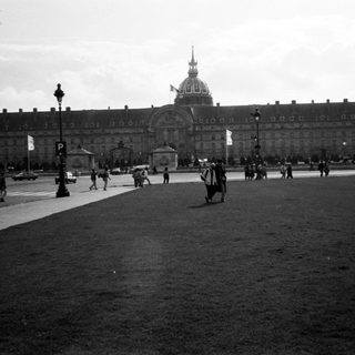 Historic building with dome, likely Hôtel des Invalides, Paris.