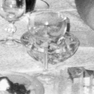 Group gathered around a long table for a social meal.
