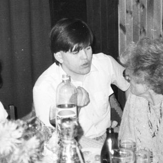 Family gathering at a table indoors.