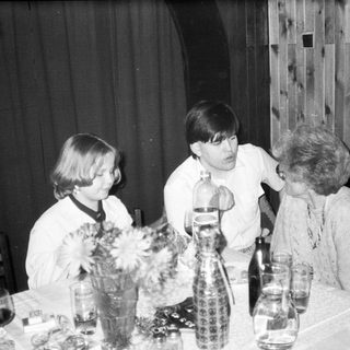 Family gathering at a table indoors.
