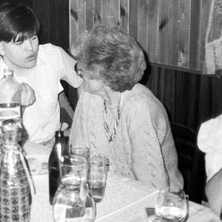 Family gathering at a table indoors.