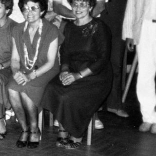 Group of people posing indoors, likely at an event.