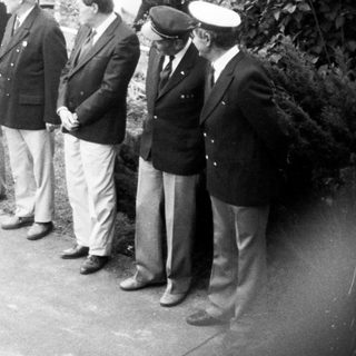 Formal outdoor ceremony with dignitaries and speeches.