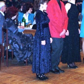 Dance event with people in formal attire.