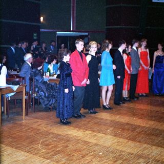 Dance event with people in formal attire.