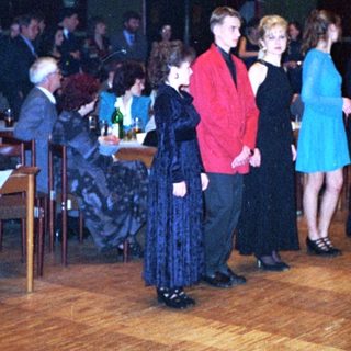 Dance event with people in formal attire.