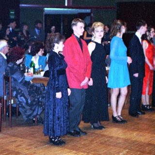 Dance event with people in formal attire.