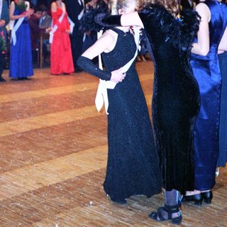 Prom or formal dance event with students in evening attire.